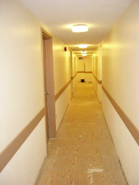 apartment hallway with wooden floor